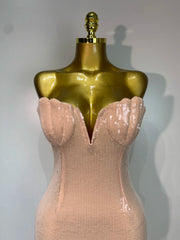 Close-up of the strapless V-neck sequin detailing on a maxi dress