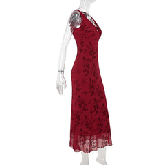 Red floral dress on a mannequin against a white background