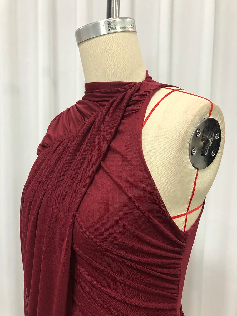 Maroon dress on a mannequin against a white background