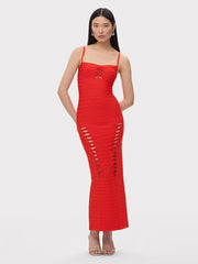 Red dress with cut-out sides worn by a model on a white background