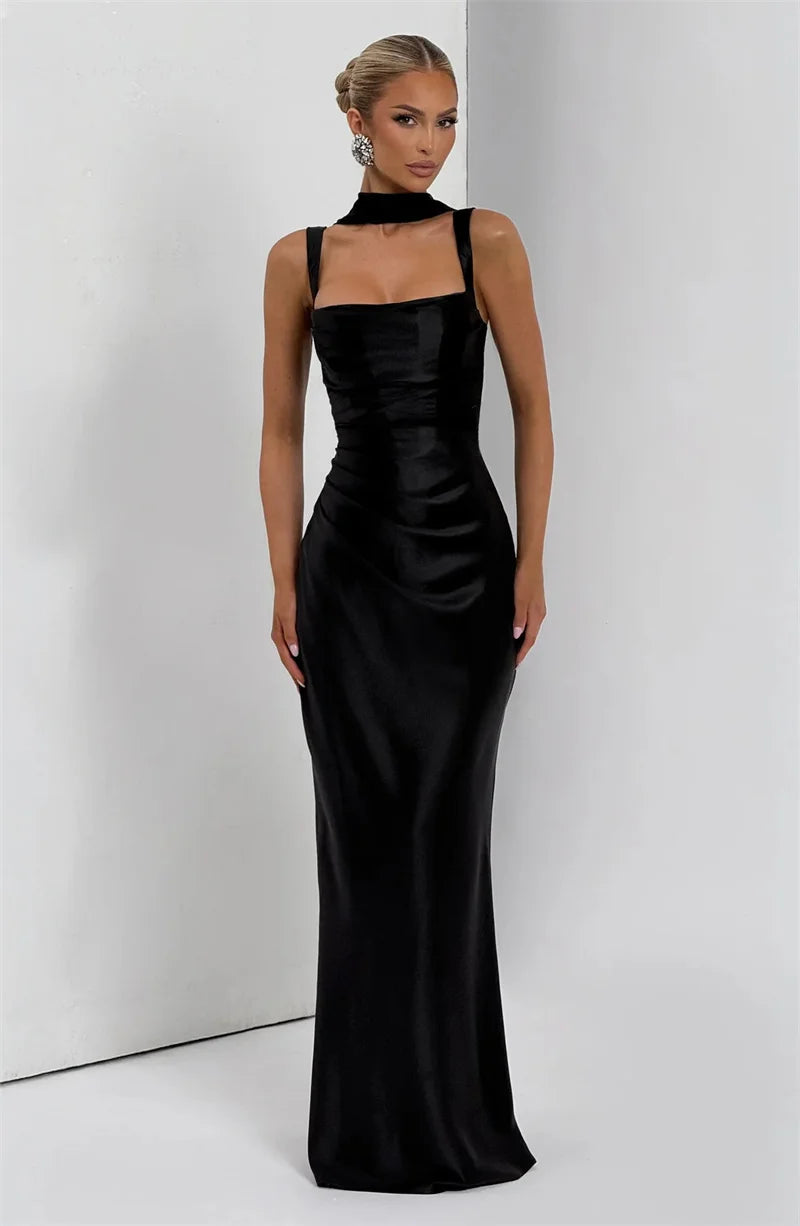 Woman wearing a black evening gown- full view