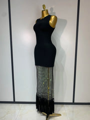 Black dress with a sheer, fringed bottom section on a mannequin against a white background