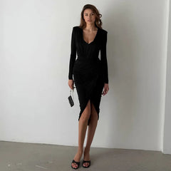 Model wearing black ruched V-neck top and skirt set