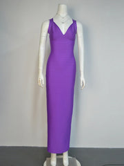 Purple evening gown on a mannequin against a plain background