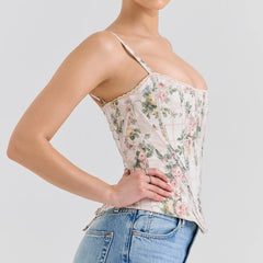 Floral corset top worn by a person on a plain background