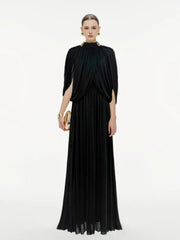 Woman wearing a black evening gown on a white background