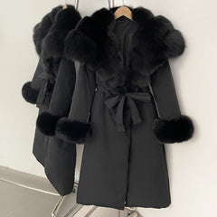 Black coat with fur trim on a hanger