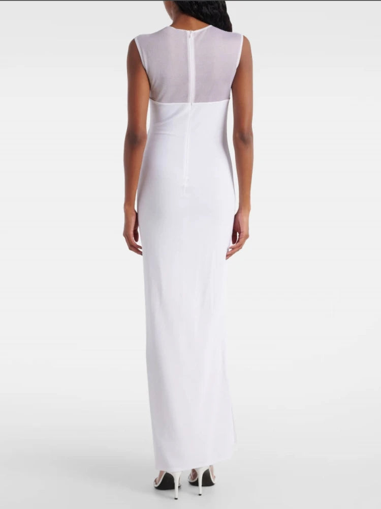 White sleeveless dress worn by a person on a white background