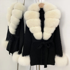 Black knit cardigan with white fur trim and belt