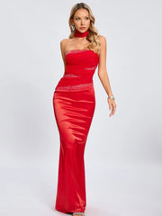 Slim satin gown with embellished waist and draped silhouette