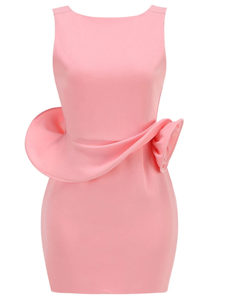 Pink dress with a large bow detail on a white background