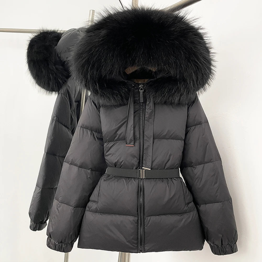 Gray puffer jacket with large black fur hood on a white background
