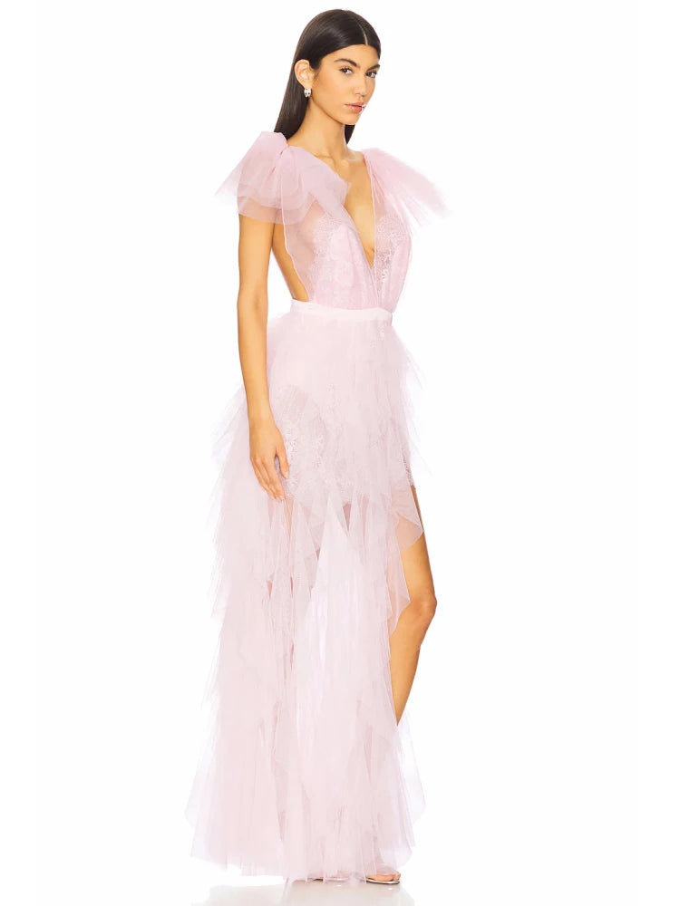 Side profile of pink tulle dress with ruffled details
