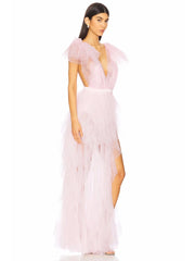 Side profile of pink tulle dress with ruffled details