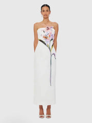 Strapless column maxi dress with floral appliqué in white.