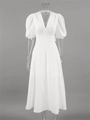 White dress on a mannequin against a gray background