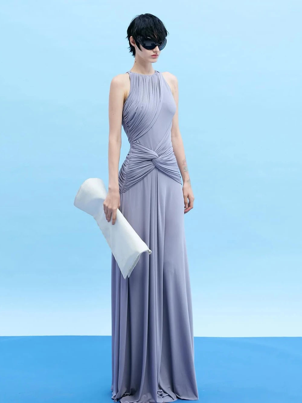 Draped halter neck maxi dress with clutch