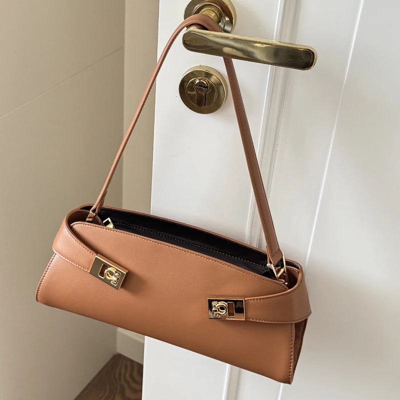Golden brown leather shoulder bag with gold lock detail