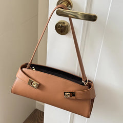 Golden brown leather shoulder bag with gold lock detail