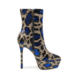 High-heeled boot with blue and gold pattern on a white background