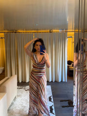 Model wearing a striped V-neck maxi dress in a mirror selfie