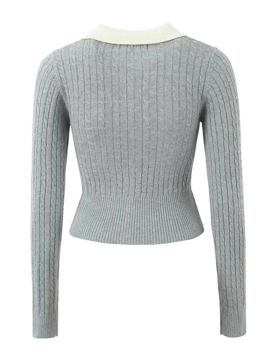 Light gray ribbed sweater with a white collar on a white background