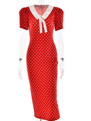 Red polka dot dress with white collar on a mannequin against a white background