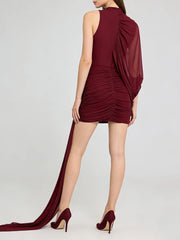 Burgundy dress with a long train on a white background