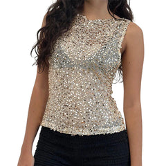 Gold sequin top worn by a person on a white background