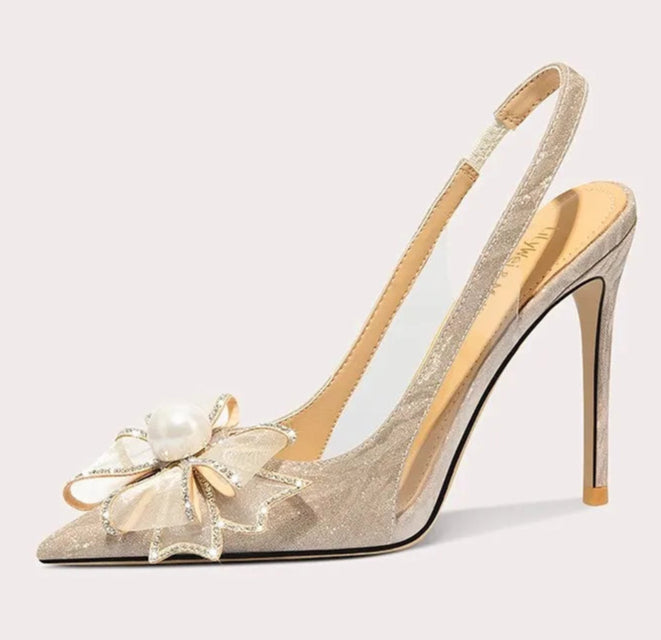 High-heeled shoe with floral design on a light gray background