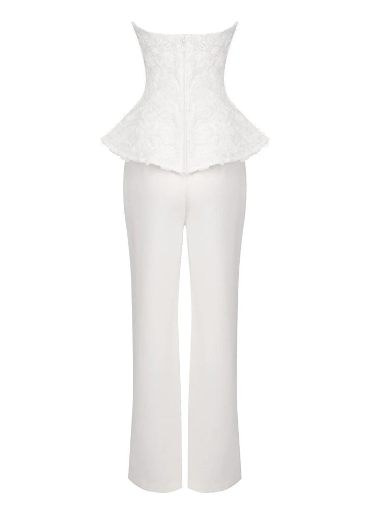 White peplum top and pants set on a white background