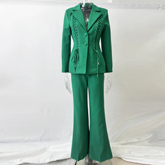 Green lace-up blazer and flared pants suit on a mannequin