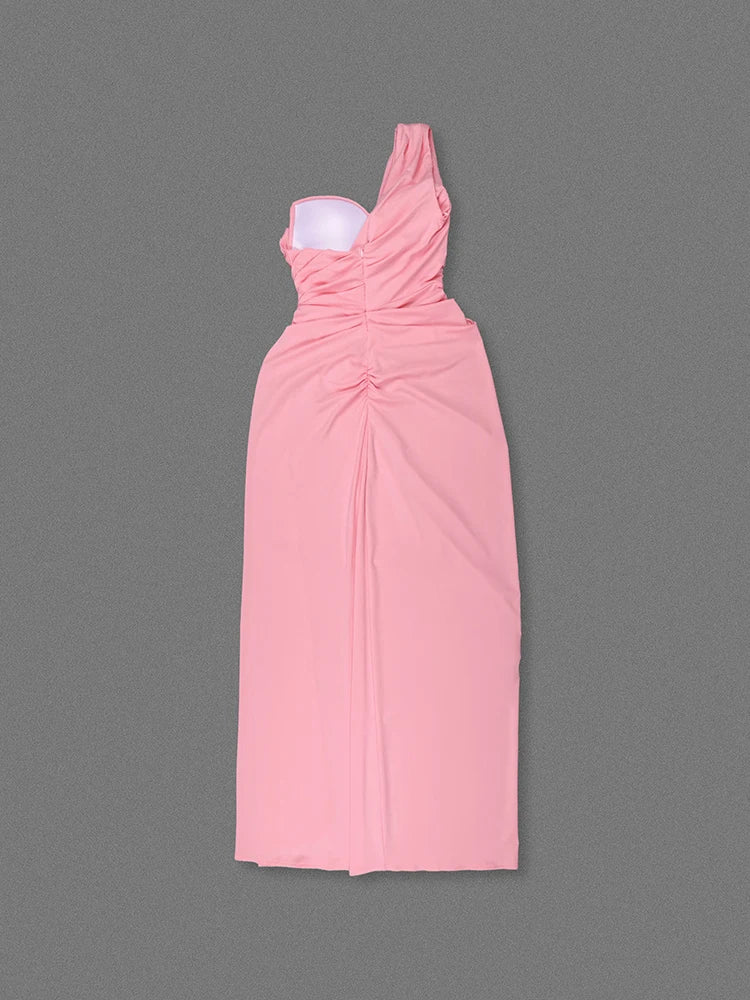 Pink one-shoulder dress on a gray background