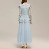 Light blue lace dress with sheer sleeves on a plain background