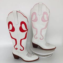 Pointed toe knee high cowboy boots with pink bow accent