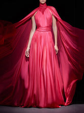 Red evening gown with cape by Modphy on a dark background