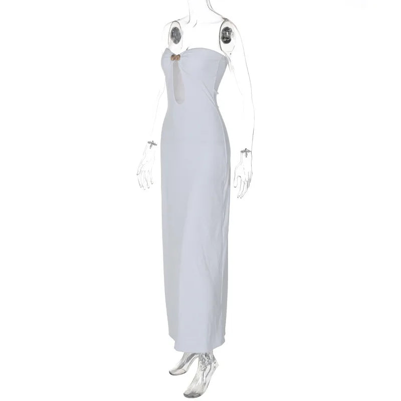 White strapless gown on a mannequin with clear boots against a white background