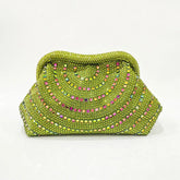 Lime green crystal-embellished clutch bag with curved pattern and chain strap