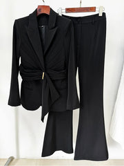 Black belted blazer and flared trousers suit hanging