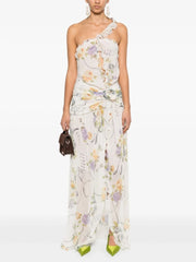 Model wearing a one-shoulder ruffled print asymmetrical neckline sleeveless ankle-length sheath dress