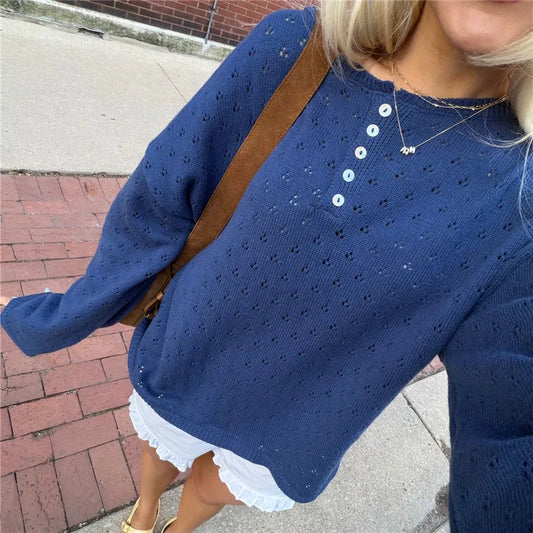 Blue eyelet knit button placket top