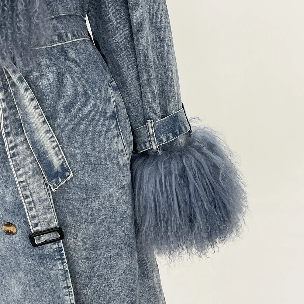 Denim coat with fluffy pom-pom detail on a neutral background