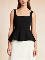 Model wearing a black square neck peplum tank top