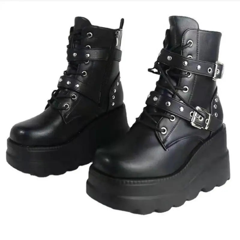 Black platform boots with buckles and straps on a white background