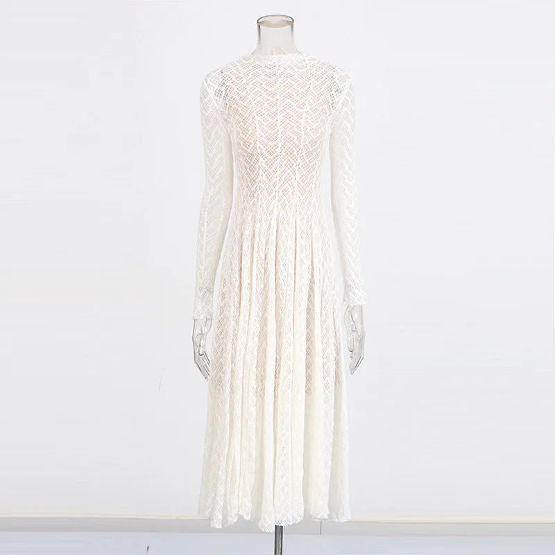 White lace dress on a mannequin against a white background