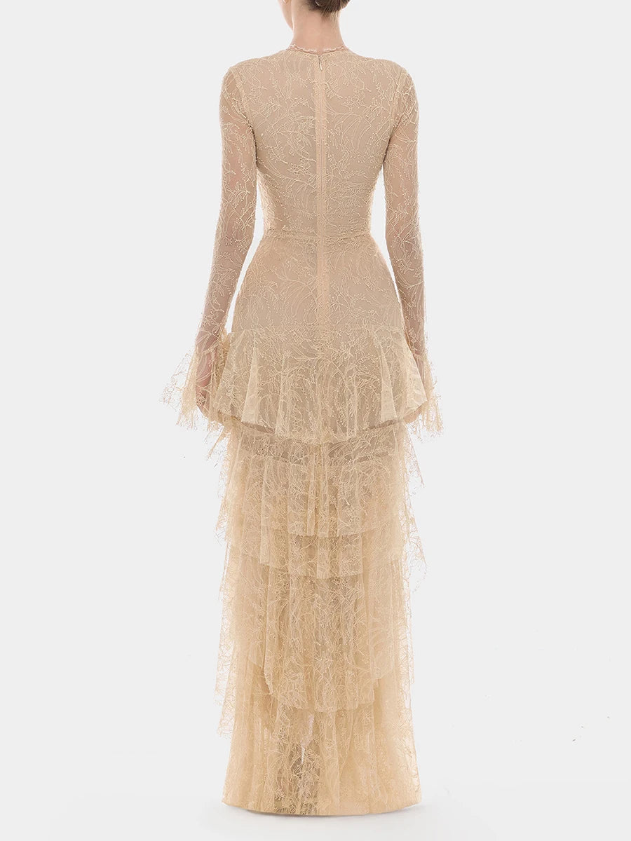 Back view of a long sleeve lace maxi dress with V-neck and ruffle skirt