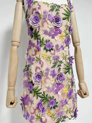 Floral dress with purple flowers on a mannequin against a white background