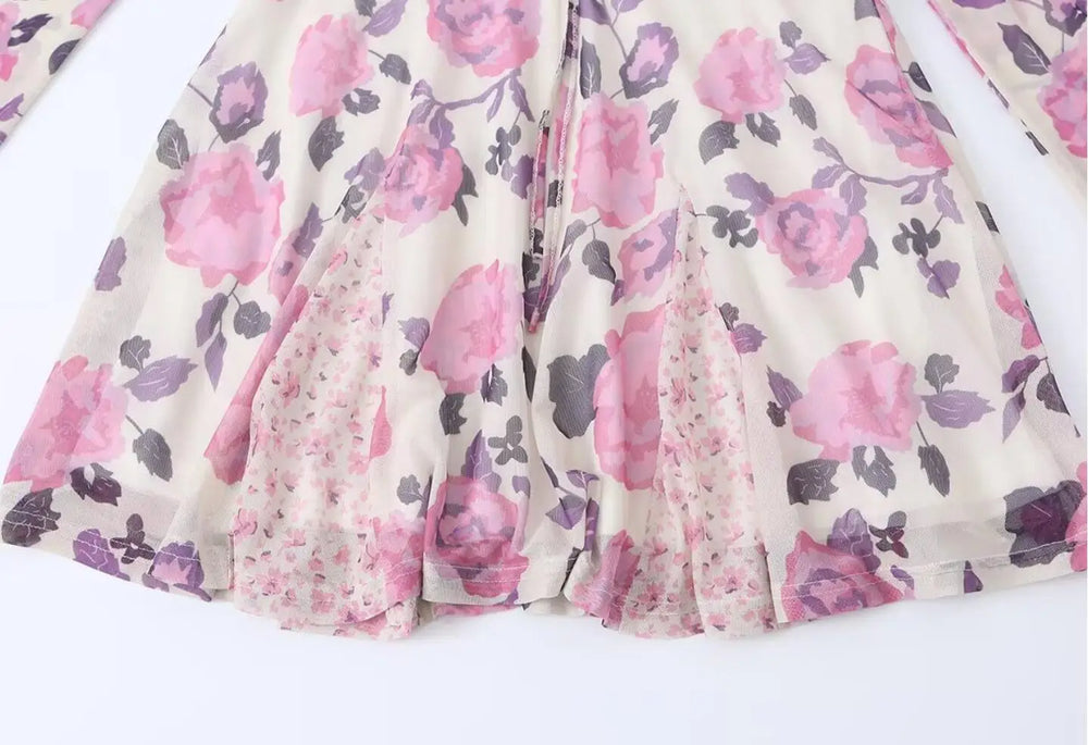 Hem detail of the floral print mesh mini dress