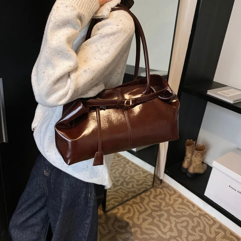 Glossy faux leather top-handle tote bag in dark brown