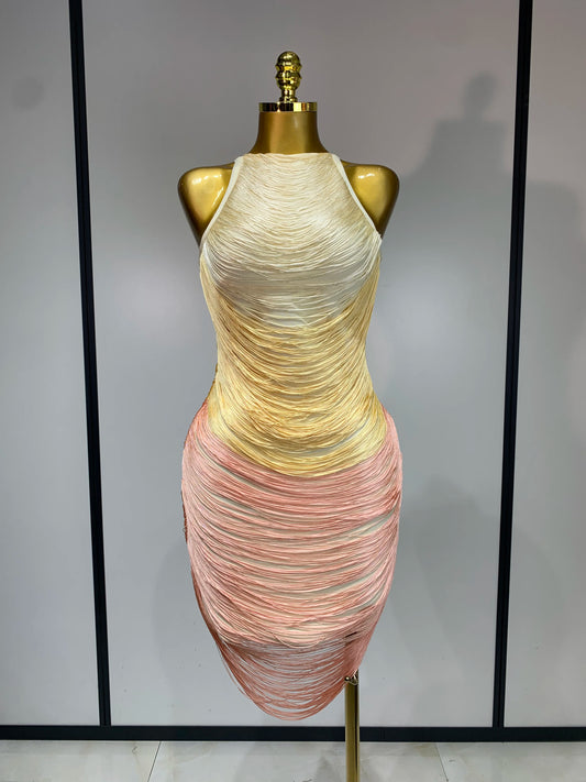 Mannequin wearing a multicolored dress with a plain background